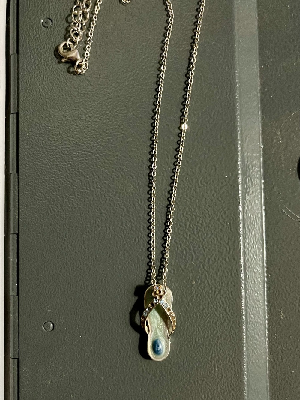 1980s Avon Silver-Tone Flip Flop Pendant Necklace with Light Blue Accent